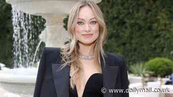 Olivia Wilde dazzles in a plunging black dress as she attends Tiffany & Co's star-studded event in Beverly Hills