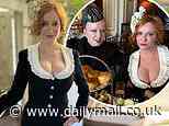 Christina Hendricks puts on a busty display in a milkmaid dress as she poses with Shirley Manson at afternoon tea ahead of her wedding to George Bianchini in New Orleans