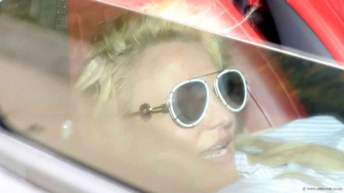 Britney Spears CRACKS windshield of Mercedes G-Wagen while crouched in passenger seat before speeding off with felon 'ex' Paul Richard Soliz in LA - as 'furious' star is seen for FIRST time after shock legal settlement with dad Jamie