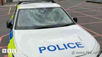 Police car damaged after man jumps on windscreen
