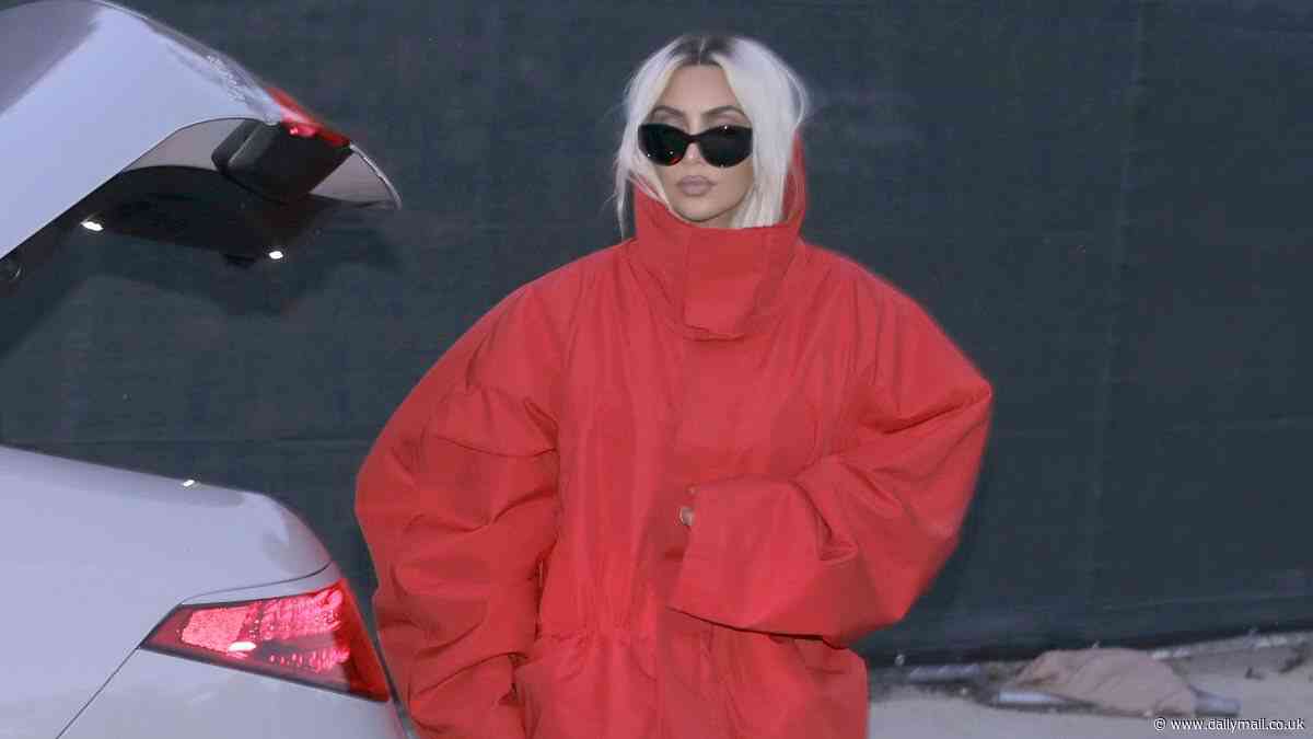 Kim Kardashian covers up in a HUGE red padded coat and shows off her new blonde locks as she heads out for dinner in Malibu after returning from the White House