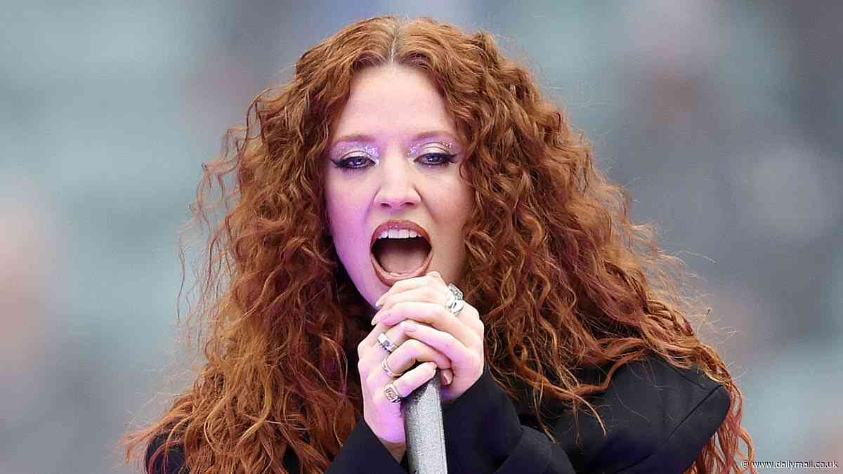 Jess Glynne showcases her figure in black crop top as she performs at The Guinness Women's Six Nations rugby tournament