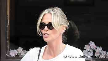 Charlize Theron cuts a casual figure in a T-shirt and patterned jeans after enjoying sushi with pals in Los Angeles