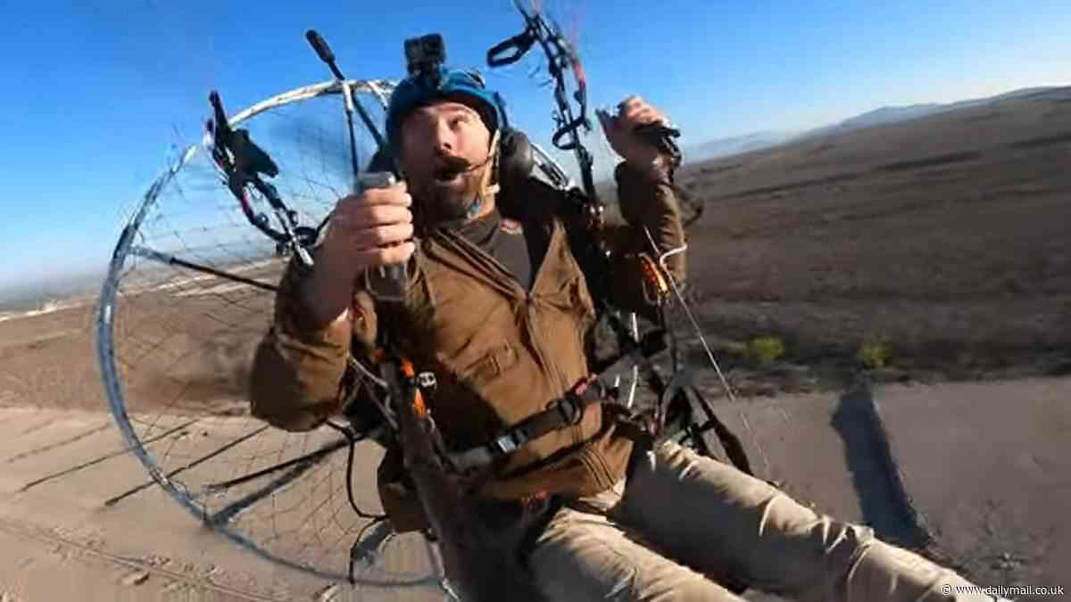 Terrifying moment motorized paraglider traveling at 50mph flips over and smashes into the Texas desert - but miraculously SURVIVES