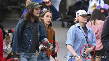 Chloe Grace Moretz and girlfriend Kate Harrison sport matching rings on their left hands during Disneyland trip - five years after they began dating