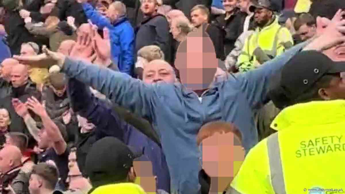 Burnley fan is spotted making sick gestures mocking the Munich air disaster during draw with Man United at Old Trafford... as club vow to help police 'identify and prosecute' supporters over tragedy chanting