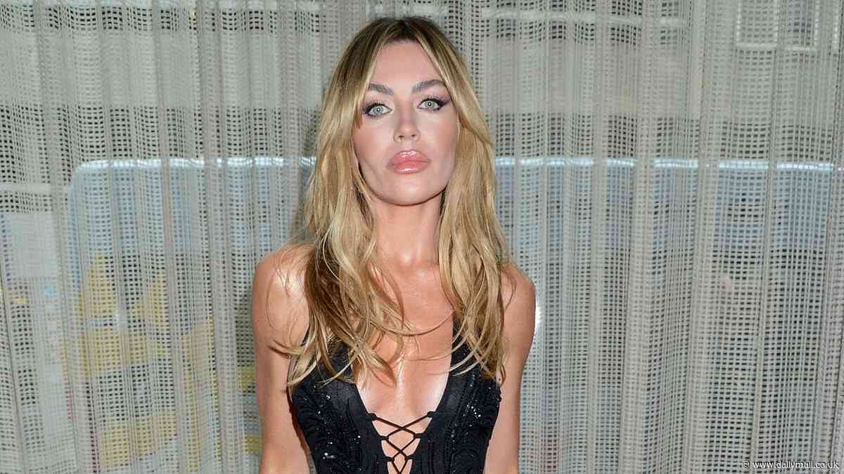 Abbey Clancy puts on a VERY busty display in a daring black glitzy gown as she cosies up to husband Peter Crouch at Variety Club Showbusiness Awards