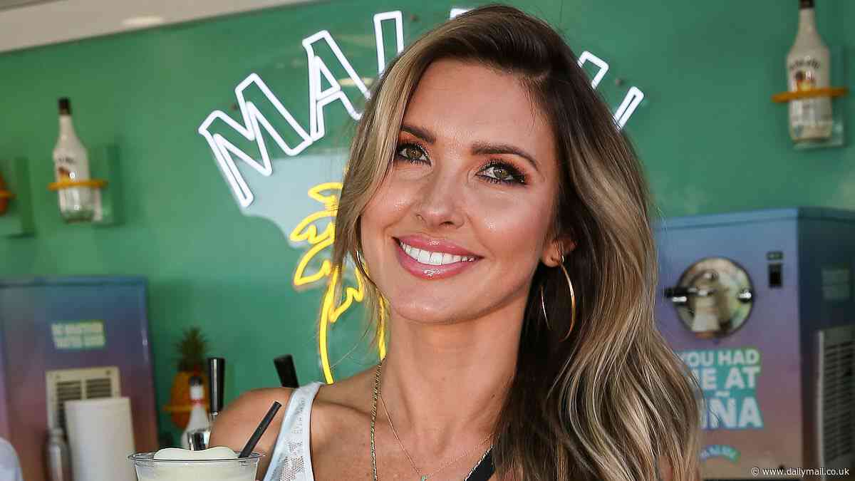 Audrina Patridge puts on a leggy display in white lace dress as she cools down with beverage at Stagecoach