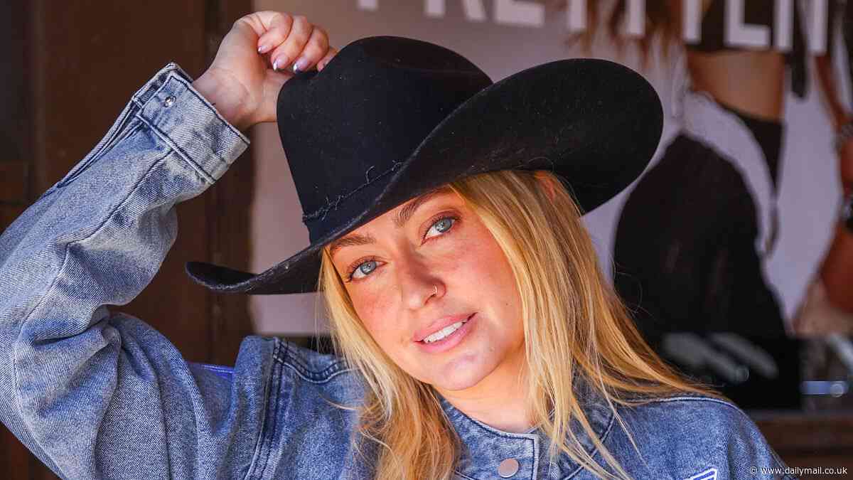 Brandi Cyrus rocks cowboy hat and denim racer jacket while attending the Stagecoach music festival...after speaking about her family dynamic