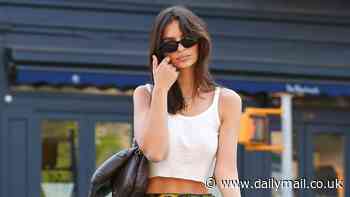 Emily Ratajkowski bares her enviable abs in a white crop top and flirty green skirt while stepping out in NYC