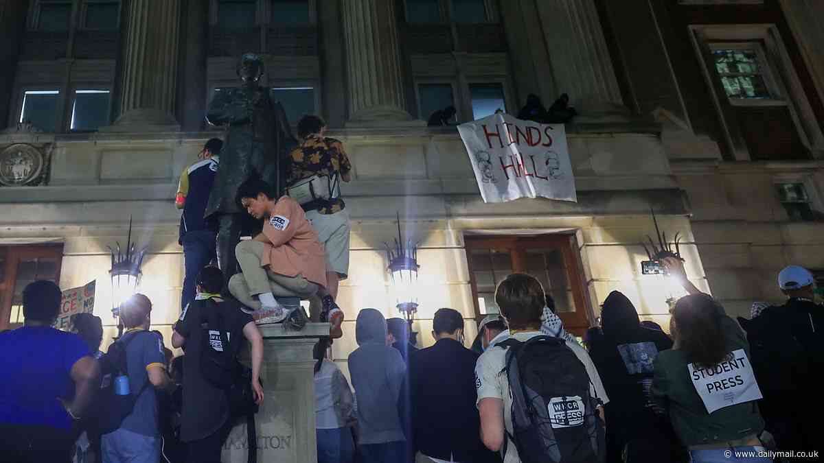 Anti-Israel activists smash through windows to seize historic building on Columbia University campus and say they won't leave until 'all of their demands are met'