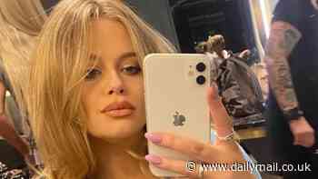 Pregnant Emily Atack shows off her baby bump in a figure hugging black dress and a denim shirt as she poses for selfies at the hairdressers