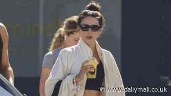 Michelle Keegan flashes her toned abs in black gym wear as she leaves a pilates class at Sydney's Bondi Beach