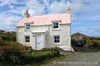 Sea view cottage with bubblegum pink roof that's nothing like you'd expect inside