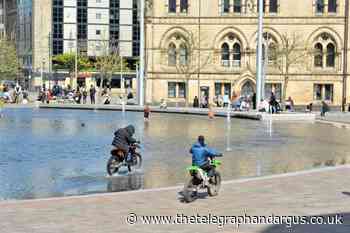 Yobs ride dirt bikes across City Park,  Bradford city centre