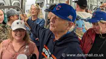 Hollywood star Bill Murray rides the subway with fellow Cubs fans after watching Chicago's 3-1 win over the Mets at Citi Field