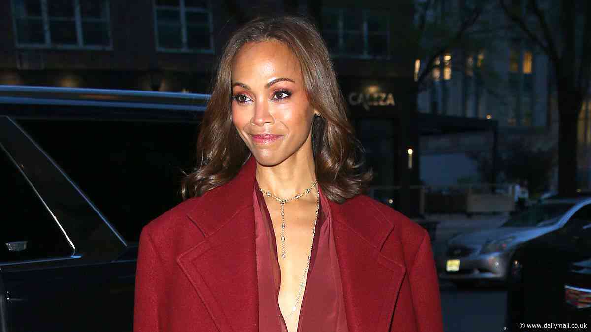 Zoe Saldana wows in a monochrome cranberry-colored ensemble as she leaves her hotel in New York City