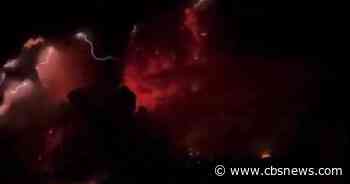 Thousands flee as video captures dramatic eruption of Indonesian volcano