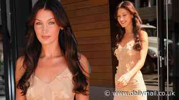 Bella Hadid looks sensational in a slinky nude dress in New York City after launching her own fragrance company called Orebella