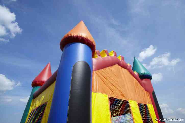 Child killed, another injured after bounce house swept up by wind