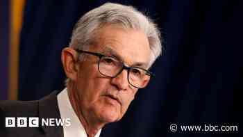 Fed holds key interest rate and warns on inflation