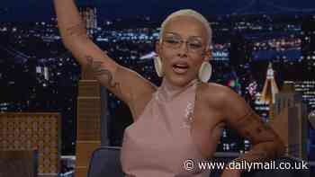 Doja Cat wears THONG for very cheeky appearance on The Tonight Show Starring Jimmy Fallon but comes over all shy when it's time to dance: 'Don't look at my a**!'