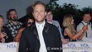 Olly Murs poses with baby daughter Madison after 'extra special' night