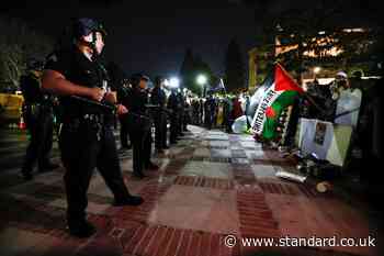 Dozens of arrests at UCLA as riot police storm protest after hundreds standoff against police