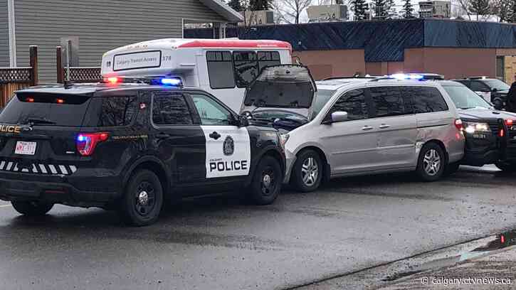 Calgary police stop erratic vehicle driving with its hood up