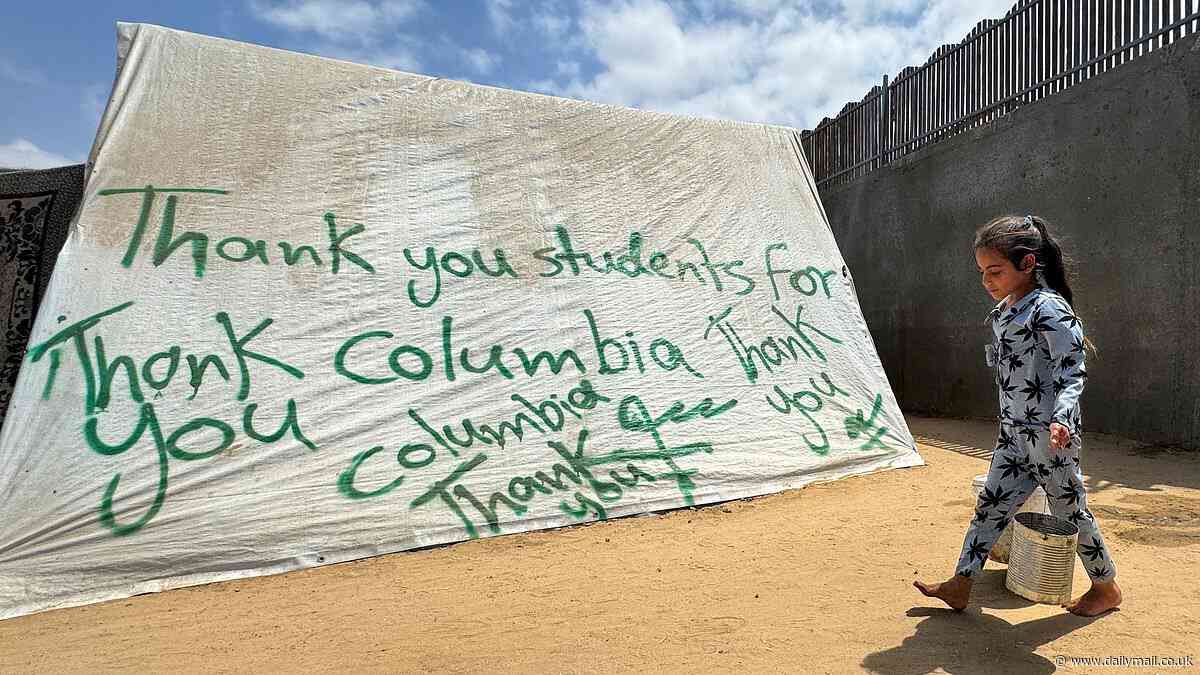 Surreal war photo taken in razed streets of Gaza shows Palestinians' praise for American protest at Columbia University