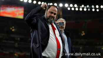 Nottingham Forest owner Evangelos Marinakis in the crowd at Villa Park watching his Olympiacos side... as they attempt to spoil Aston Villa's dream of reaching first European final in 42 years