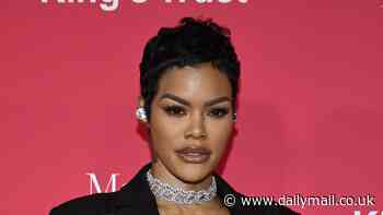 Teyana Taylor looks fierce in towering platform boots while carrying a jeweled camera-shaped clutch at The King's Trust Global Gala in NYC