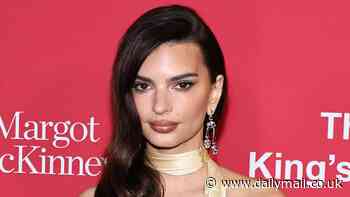 Emily Ratajkowski flaunts her ample cleavage in an extreme plunging satin gown as she attends The King's Trust Global Gala