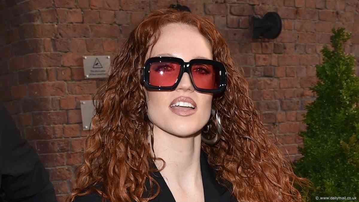 Jess Glynne and girlfriend Alex Scott enjoy a night on the town as they leave swanky hotel and head to Liverpool's largest Irish pub