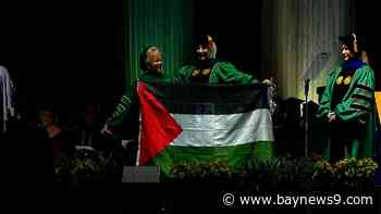 Graduating student pulls out Palestinian flag at first USF Commencement ceremony