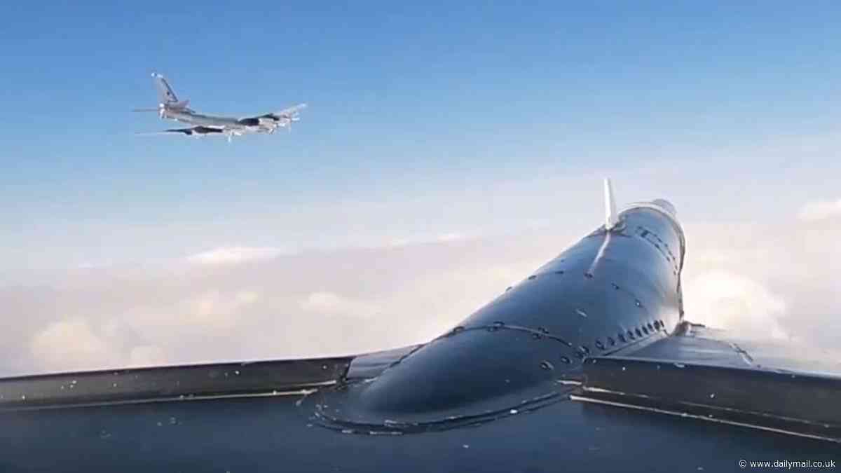 Stand off in the skies: Moment US F-16 fighters are scrambled to intercept Russian nuclear bomber near Alaska airspace in latest flashpoint between two superpowers