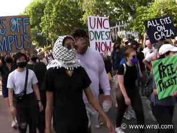 Pro-Palestinian protesters march at UNC Friday morning after university puts up 12-foot barricade, closes Campus Y
