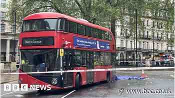 Woman hit by double-decker bus outside station