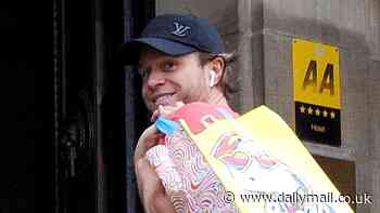Olly Murs is all smiles as he FINALLY arrives in Glasgow after he was forced to cancel his concert with Take That