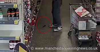 Hapless shoplifter caught on CCTV stealing sweets and wine after knife fell out of his trousers