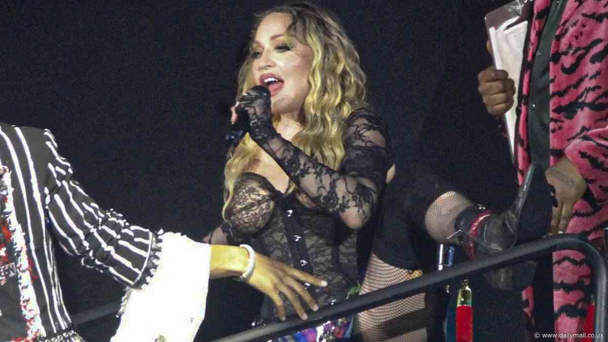 Madonna, 65, puts on a VERY saucy display as she flashes her underwear on stage before cosying up to a hunky backup dancer during final concert of her Celebration Tour in Brazil