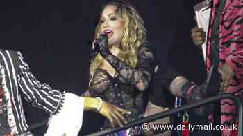 Madonna, 65, puts on a VERY saucy display as she flashes her underwear on stage before cosying up to a hunky backup dancer during final concert of her Celebration Tour in Brazil
