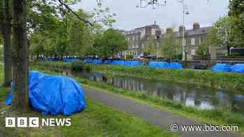 Asylum seekers put up tents along Dublin canal