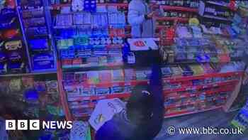 Shopkeeper tackles robber armed with gun