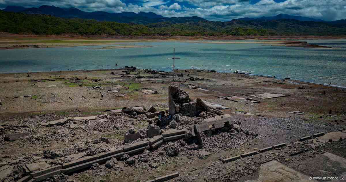 Eerie photographs capture mysterious 300-year-old sunken town re-emerging from dried up lake