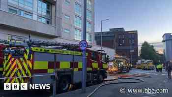 Man charged after fire in car park of city flats