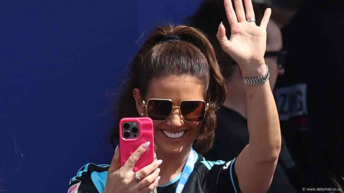 Rebekah Vardy is every inch the proud wife as she supports footballer husband Jamie at Leicester City's trophy parade as they return to the Premier League