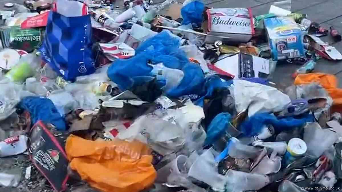 Ipswich Town fans leave extraordinary sea of litter through the town centre as supporters enjoy boozy celebrations to mark Premier Leage promotion - with council bosses telling them: 'Keep the memories, we'll handle the mess'