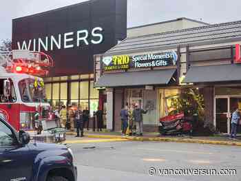 Two-vehicle crash leaves car lodged in North Vancouver mall storefront