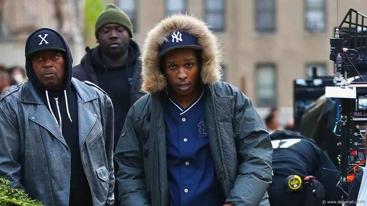 A$AP Rocky is surrounded by dozens of protesters as he films scenes for a movie on the steps of the Bronx County Courthouse in New York City